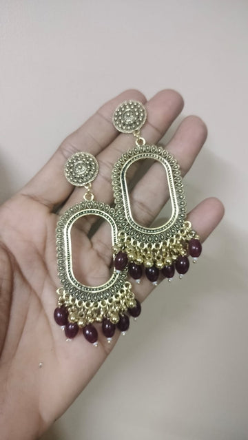 Oval shape resin jhumka base with maroon  beads golden
